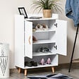 HOMCOM - Meuble à chaussures scandinave placard 2 portes 4 étagères pieds effilés inclinés bois massif panneaux particules blanc - vignette