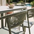 OVIALA - Table de jardin aluminium 213x90 cm et 8 chaises textilène vert - Nocera - vignette